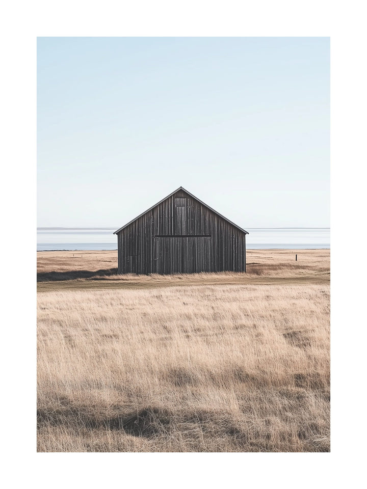 Old wooden barn in dry coastal field near the Swedish west coast