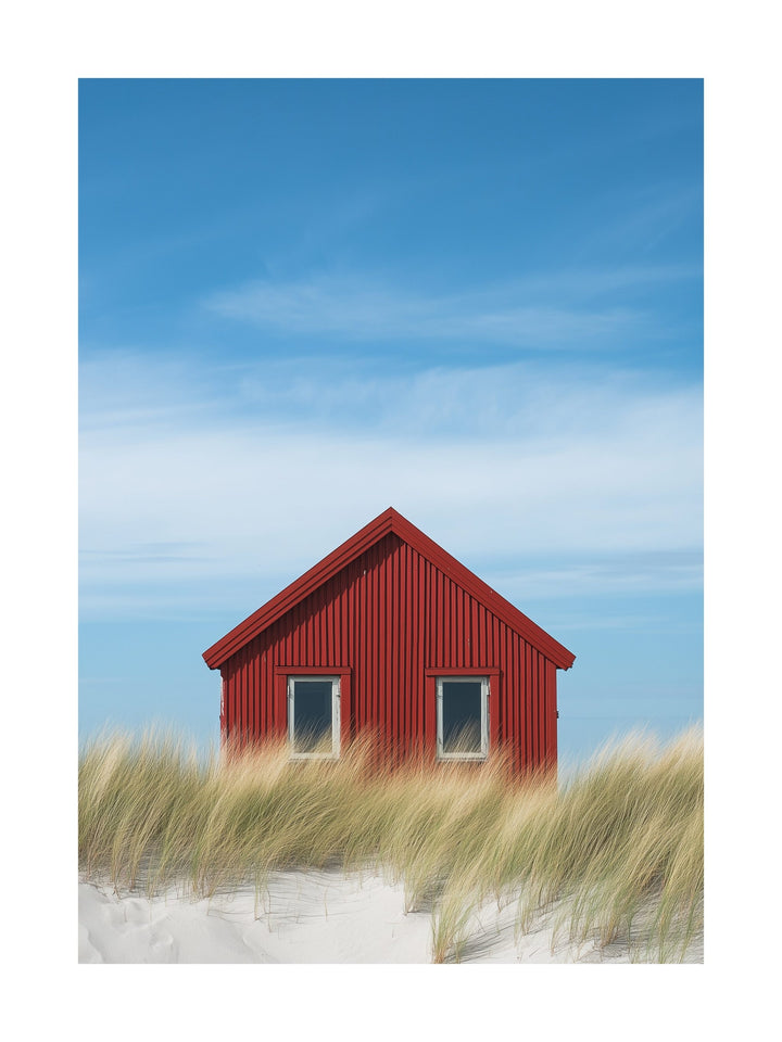 Red cabin in Falsterbo surrounded by beach grass and blue sky