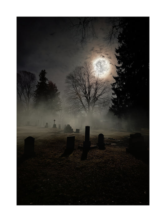 Poster of a foggy graveyard at night with tombstones and moonlight