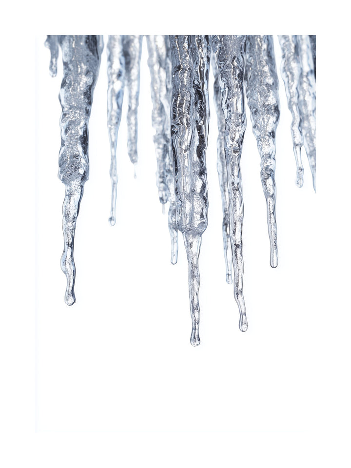 Macro photograph of shiny frozen icicles hanging in winter.